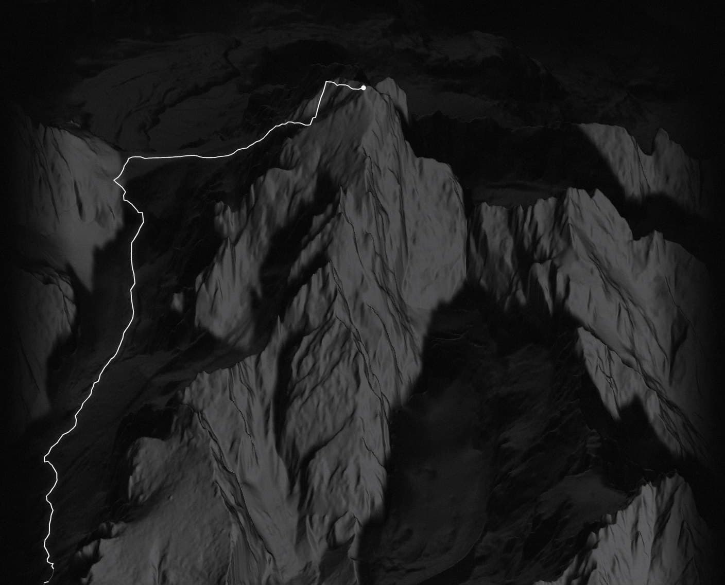 The Grand Teton summit lit by the 6:45 AM sun